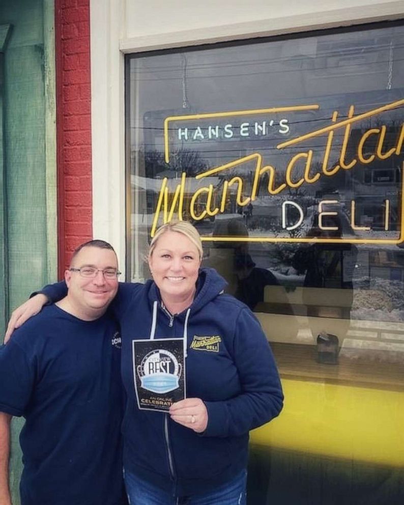 PHOTO: Carey Hansen and her husband Corey stand outside their deli in Des Moines, Iowa, in January.