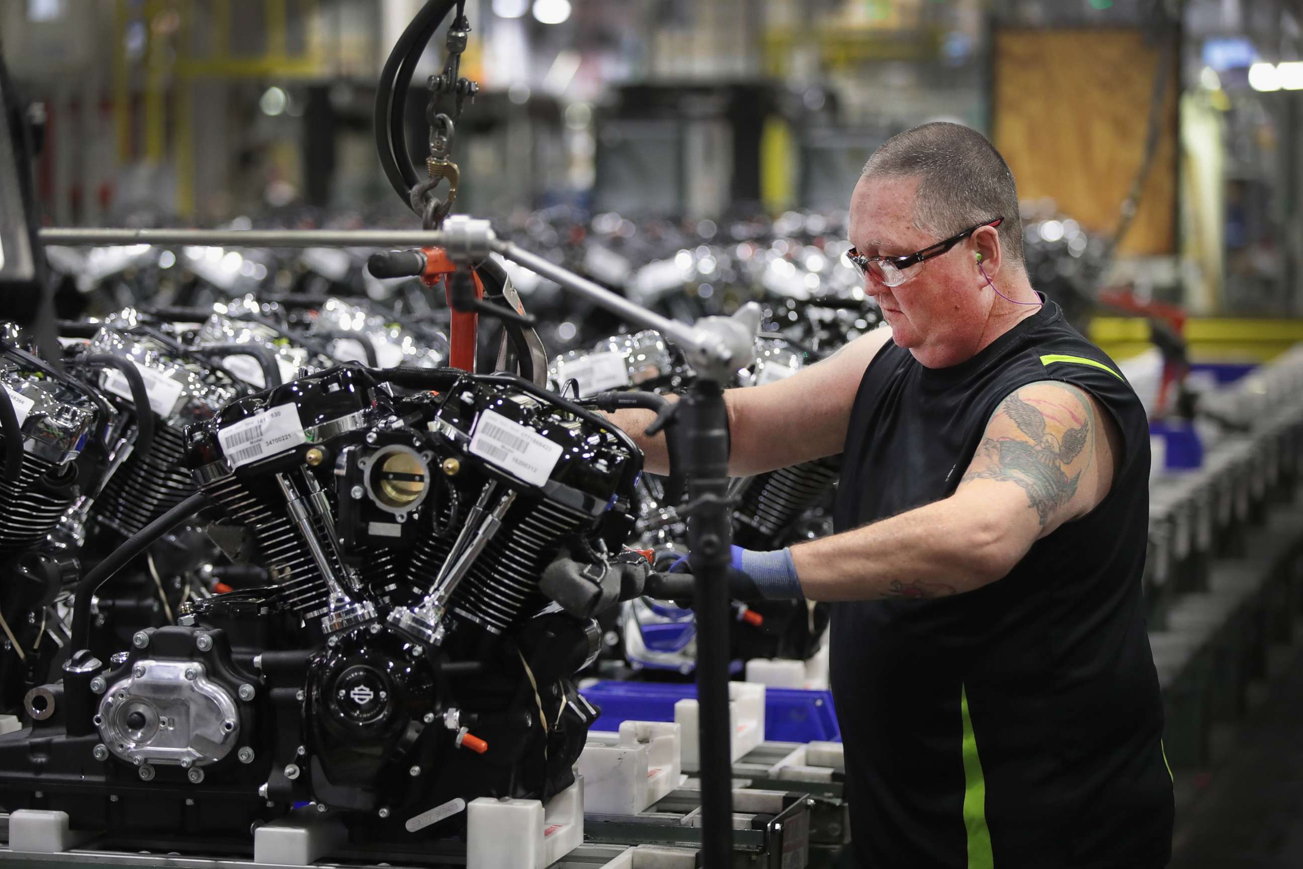 PHOTO: Harley-Davidson motorcycle engines are assembled at the company's Powertrain Operations plant, June 1, 2018 in Menomonee Falls, Wis.