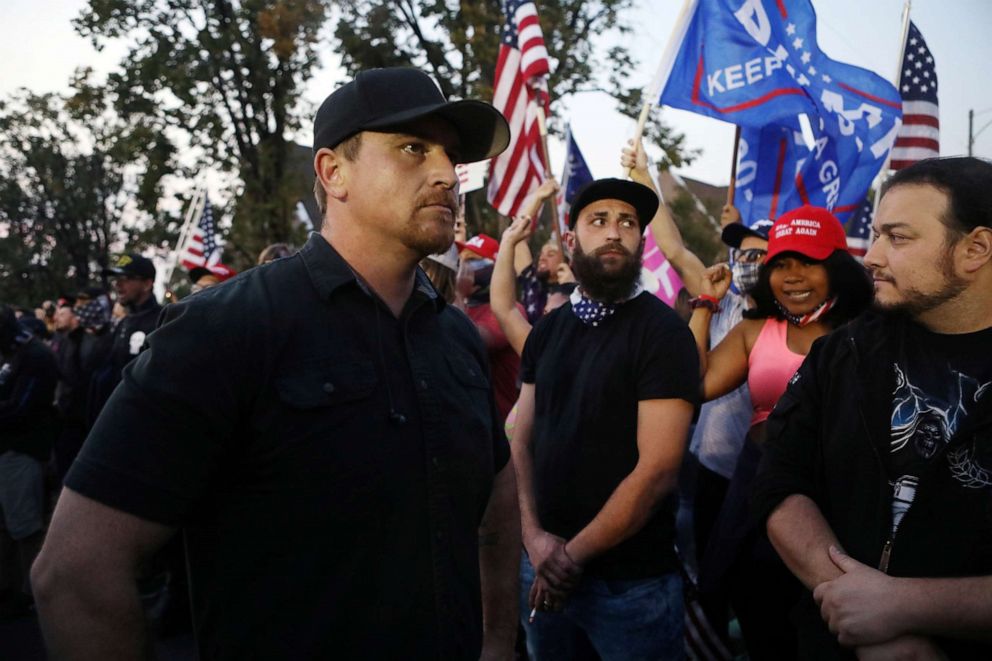 PHOTO: Members of the far-right Proud Boys stand in front of demonstrators outside the site of the 2020 vice presidential debate at the campus of the University of Utah in Salt Lake City, Oct. 7, 2020.