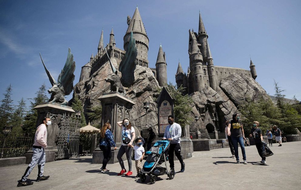 PHOTO: Guests walk by Hogwarts Castle inside The Wizarding World of Harry Potter area on reopening day of Universal Studios Hollywood during the outbreak COVID-19, in Universal City, Calif., April 15, 2021.