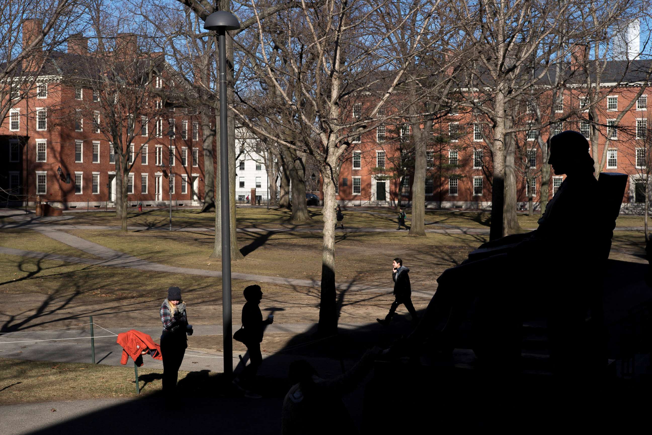 PHOTO: A statue of John Harvard looks over Harvard Yard at Harvard University in Cambridge, Mass., Jan. 20, 2015.