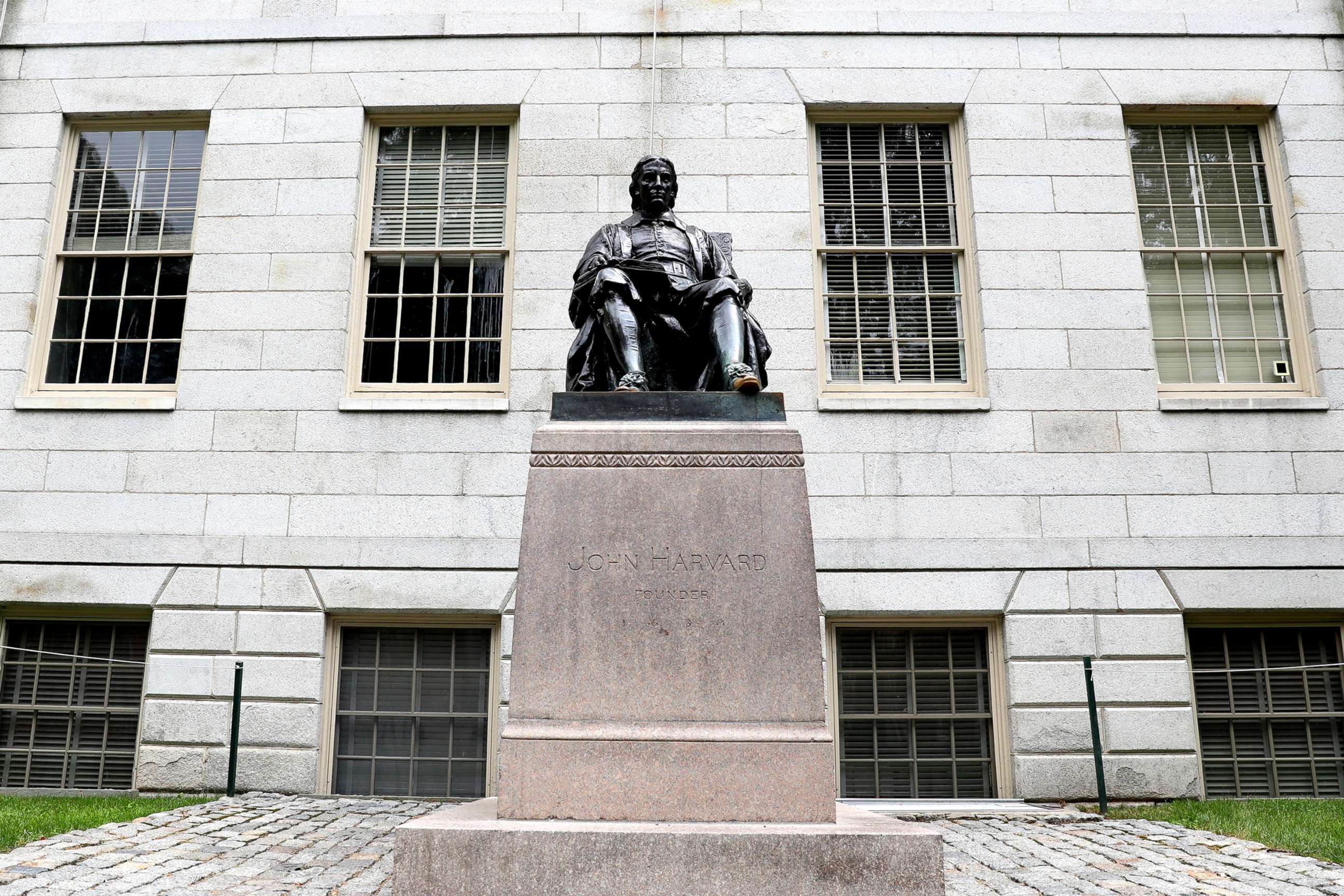 PHOTO: A view of the statue of John Harvard on the campus of Harvard University, July 8, 2020, in Cambridge, Mass.