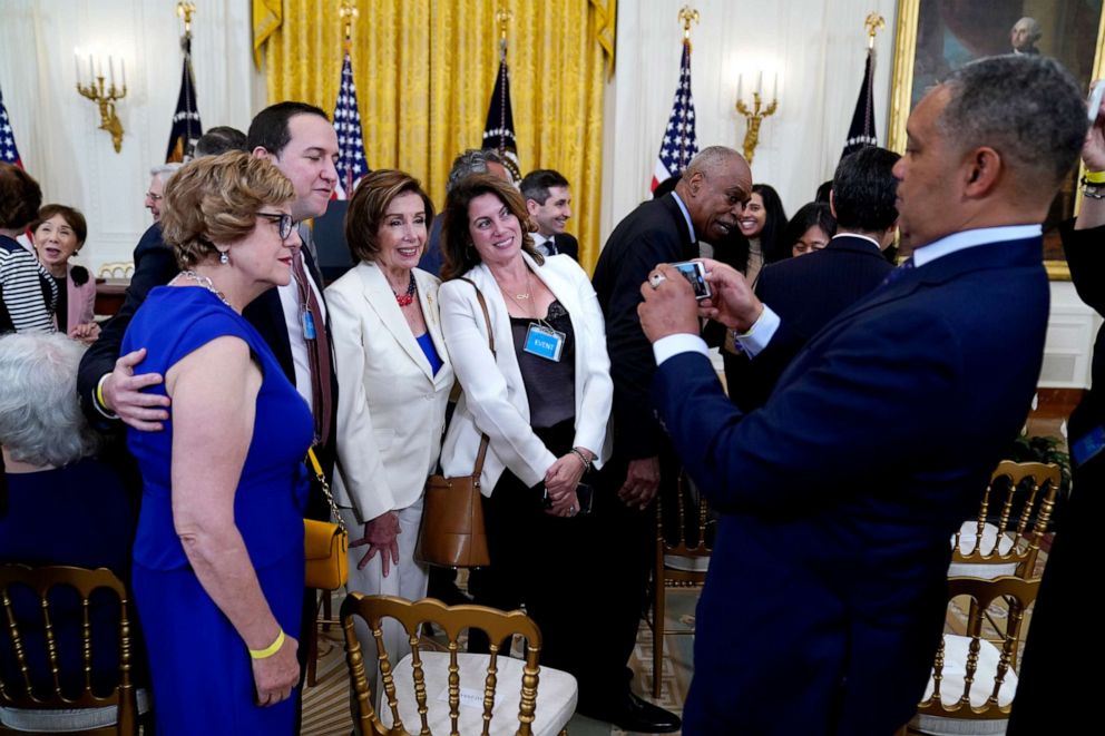 PHOTO: House Speaker Nancy Pelosi poses for a photo before the signing the COVID-19 Hate Crimes Act, in the East Room of the White House, May 20, 2021, in Washington, D.C.