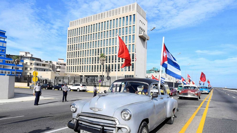 PHOTO: People participating in a rally against U.S. embargo pass by the U.S. embassy in Havana, Cuba, Aug. 5, 2021.