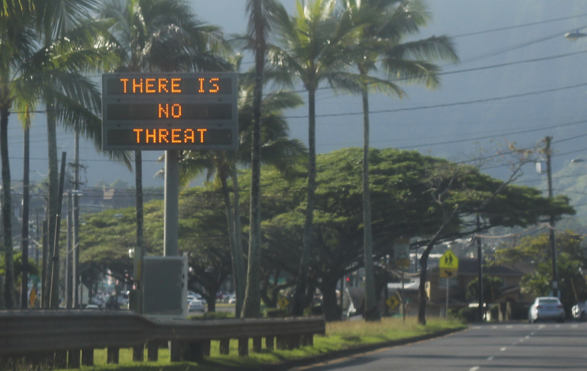 PHOTO: This Jan. 13, 2018, photo provided by Jhune Liwanag shows a highway median sign broadcasting a message of "There is no threat" in Kaneohe, Hawaii. 