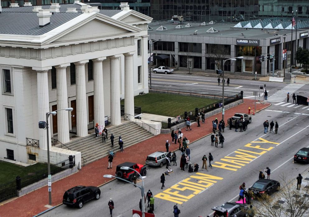 PHOTO: A sign reading "resign Hawley" painted on the street is pictured during a protest against Sen. Josh Hawley in St Louis, Jan. 9, 2021.