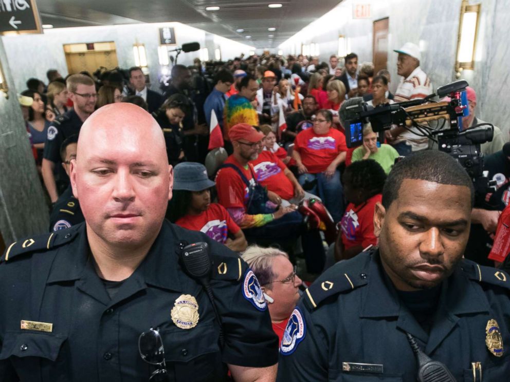 PHOTO: Capitol Police maintain order as hundreds of people, many with disabilities, arrive for a Senate Finance Committee hearing on the last-ditch GOP push to overhaul the nation's health care system, on Capitol Hill in Washington, Sept. 25, 2017. 