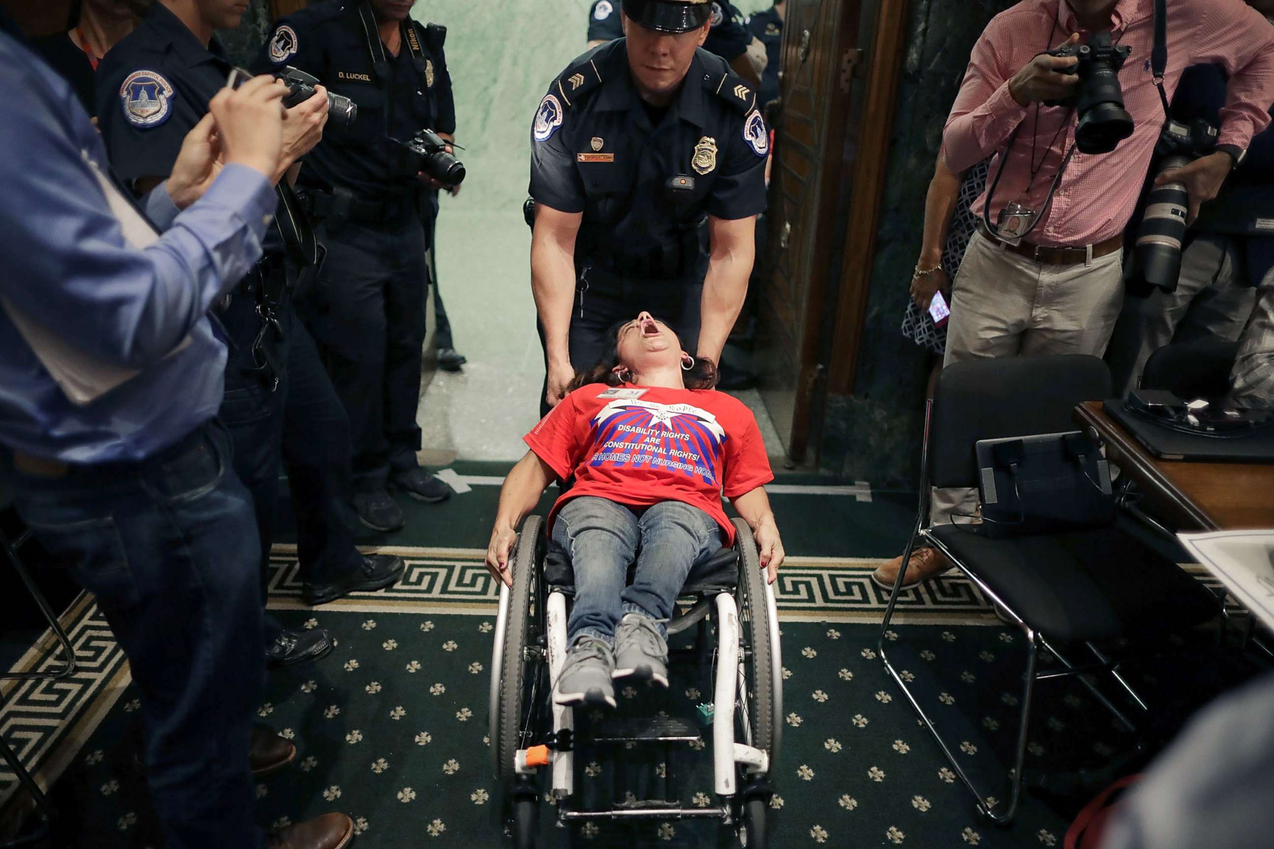 PHOTO: Capitol Police remove a protester in a wheel chair from a Senate Finance Committee hearing about the proposed Graham-Cassidy healthcare bill in the Dirksen Senate Office Building on Capitol Hill, Sept. 25, 2017, in Washington.