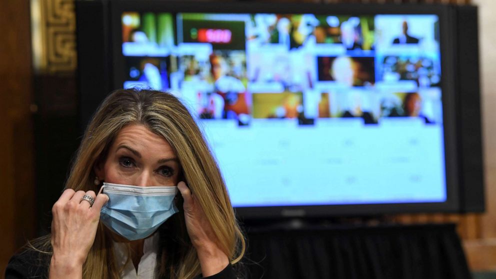 PHOTO: Senator Kelly Loeffler removes her mask before the Senate Committee for Health, Education, Labor, and Pensions hearing on the coronavirus disease (COVID-19), in Washington, May 12, 2020.