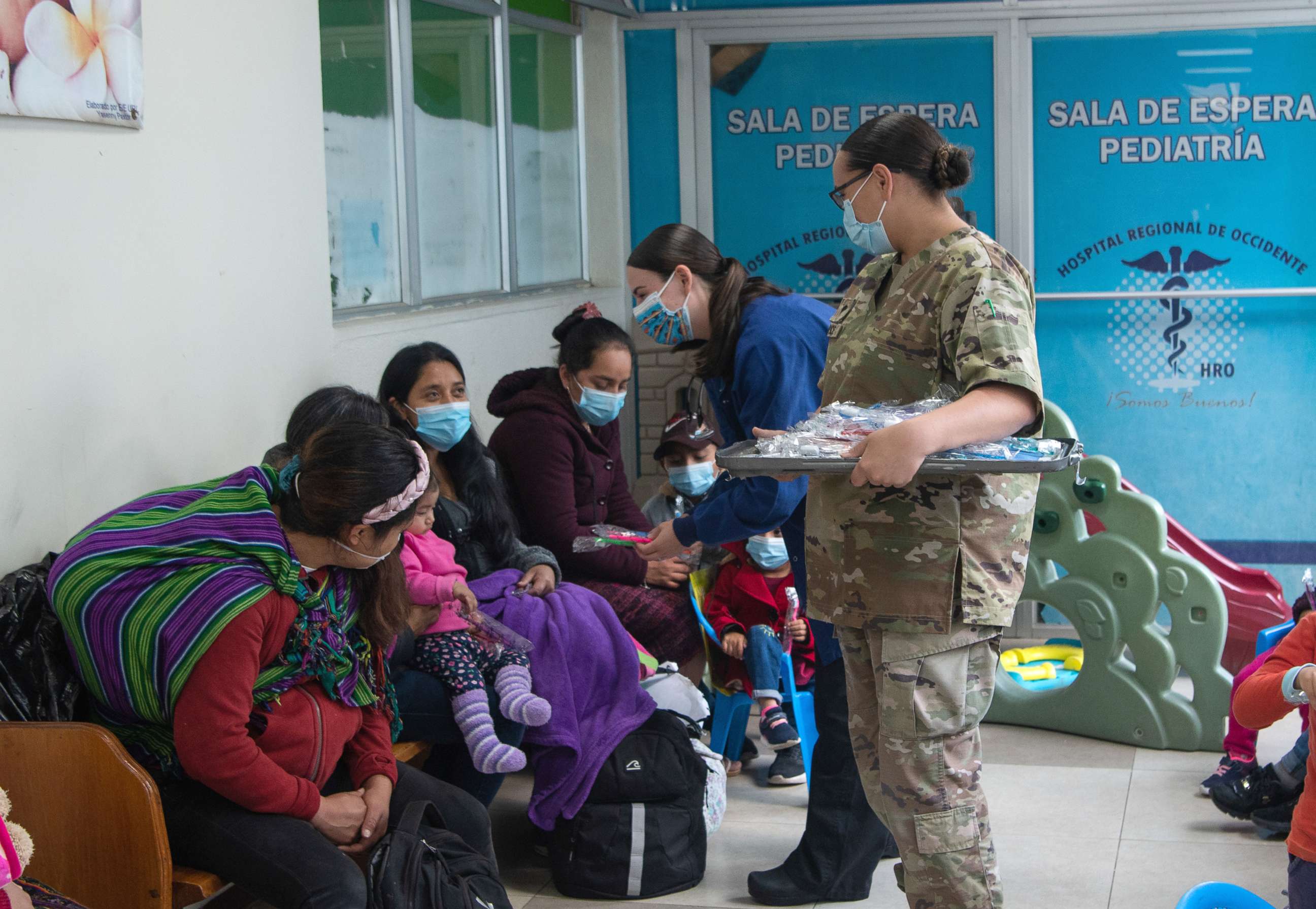 PHOTO: U.S. military dental specialist with HEART 22, hand out toothbrushes to children at Hospital Regional de Occidente in Quetzaltenango, Guatemala, Aug. 24, 2022.