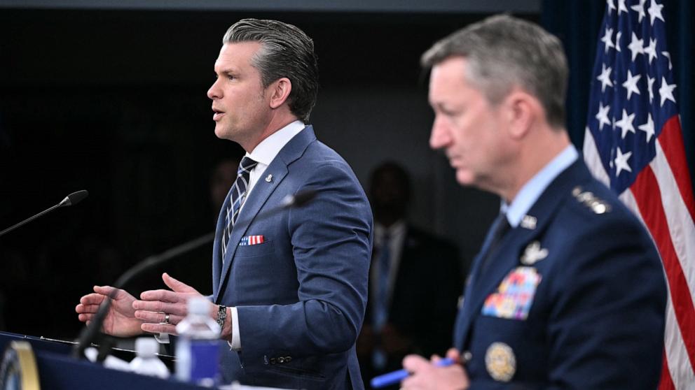 PHOTO: Secretary of Defense Pete Hegseth and Chairman of the Joint Chiefs of Staff General Dan Caine speak during a news conference at the Pentagon in Washington, DC, on March 19, 2026. 