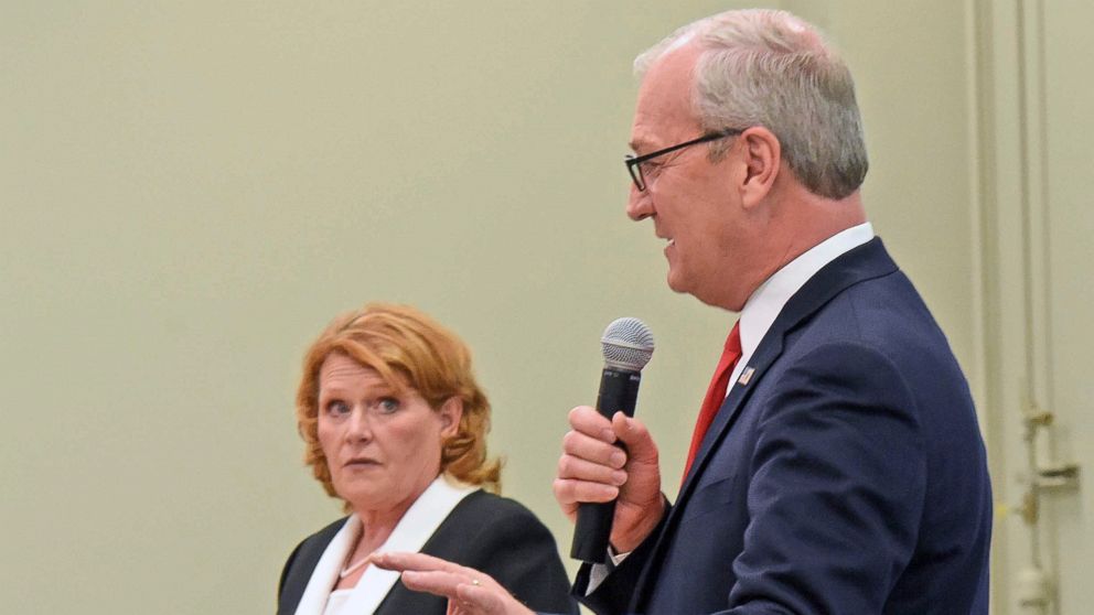 PHOTO: Republican U.S. Rep. Kevin Cramer, front, makes a point as North Dakota Democratic U.S. Sen. Heidi Heitkamp listens during the U.S. Senate Candidate Debate on Thursday night, Oct. 18, 2018, in Bismarck, N.D.