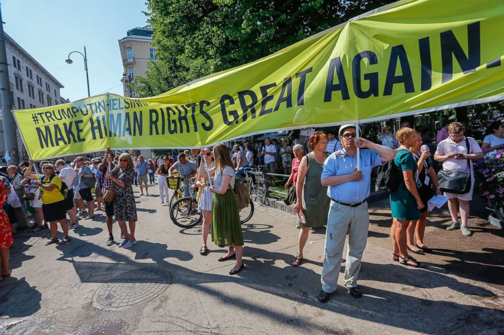 PHOTO: People take part in a demonstration calling for human rights and democracy in Helsinki, Finland, July 16, 2018, on the day of the summit between President Donald Trump and Russian President Vladimir Putin.