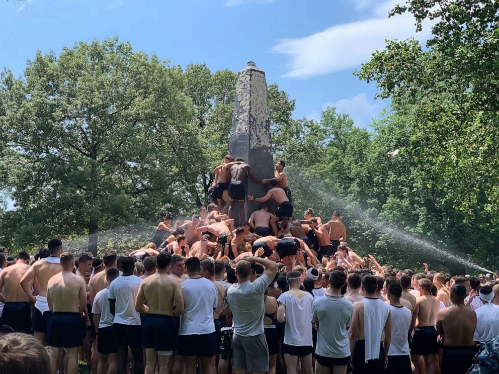 PHOTO: U.S. Naval Academy freshmen climb the Herndon Monument to mark the end of the year, May 20, 2019, in Annapolis, Md. 