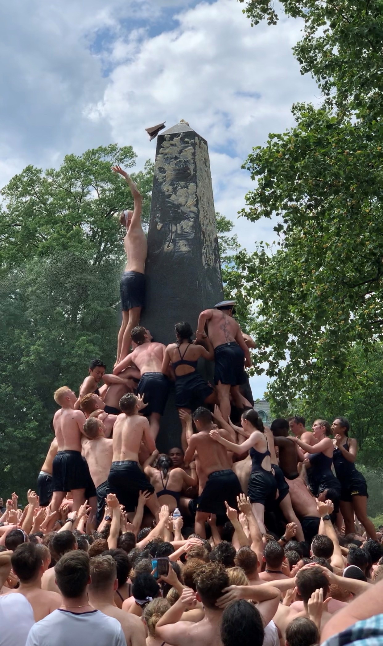 PHOTO: U.S. Naval Academy freshmen climb the Herndon Monument to mark the end of the year, May 20, 2019, in Annapolis, Md. 