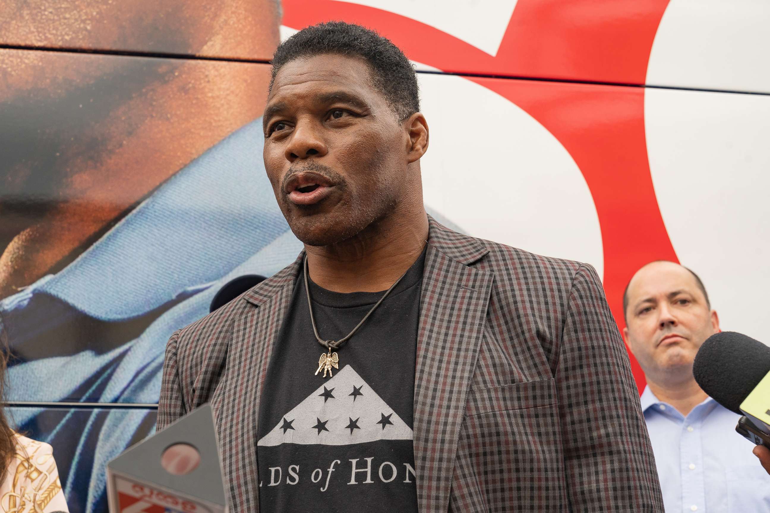 PHOTO: U.S. Republican Senate candidate for Georgia, Herschel Walker speaks to media at a campaign event on Sept. 9, 2022 in Gwinnett, Georgia.