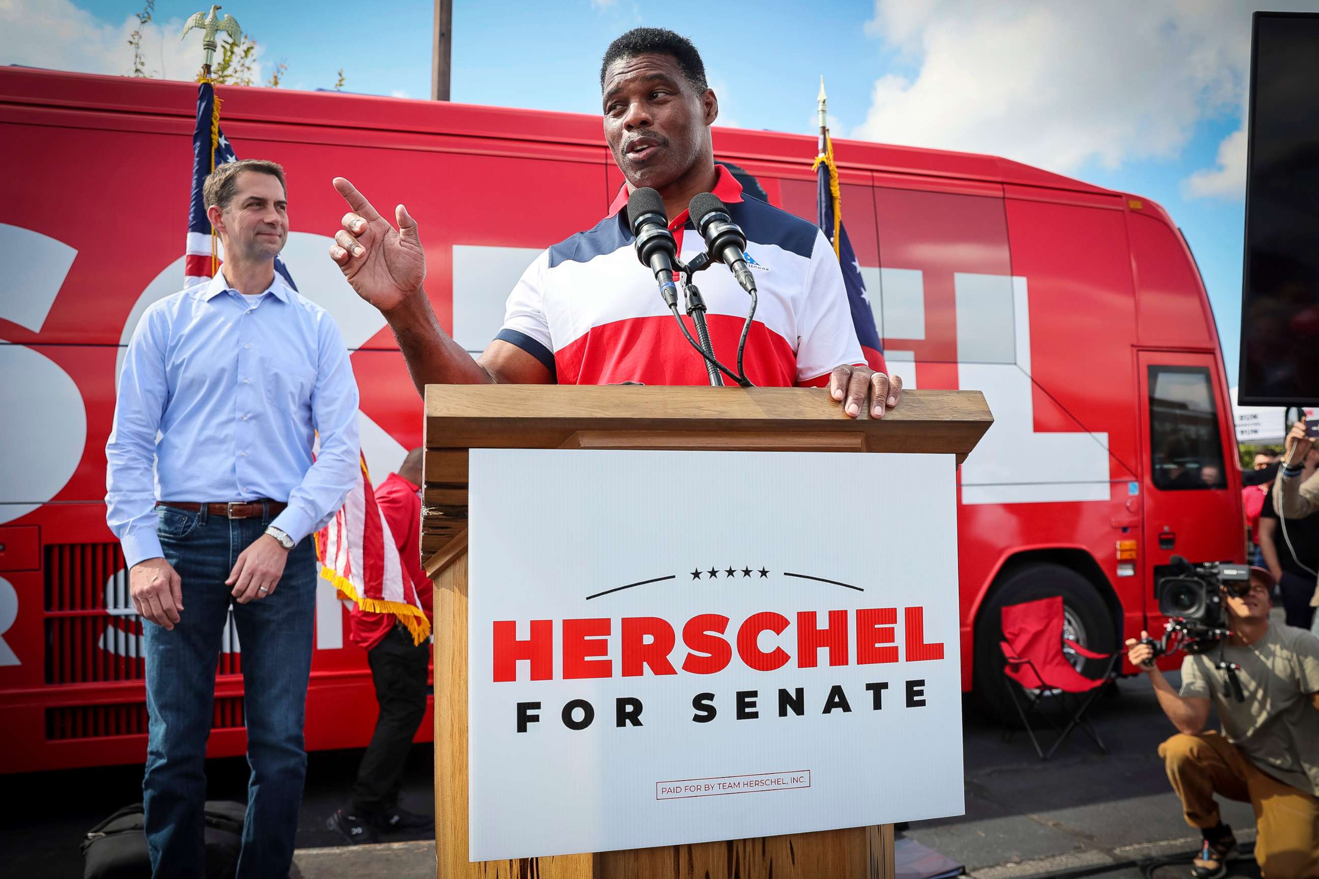 PHOTO: Herschel Walker, a Republican Senate candidate for Georgia, speaks at his "United Georgia" campaign bus tour with Sen. Tom Cotton, in Carrollton, Ga., Oct. 11, 2022.