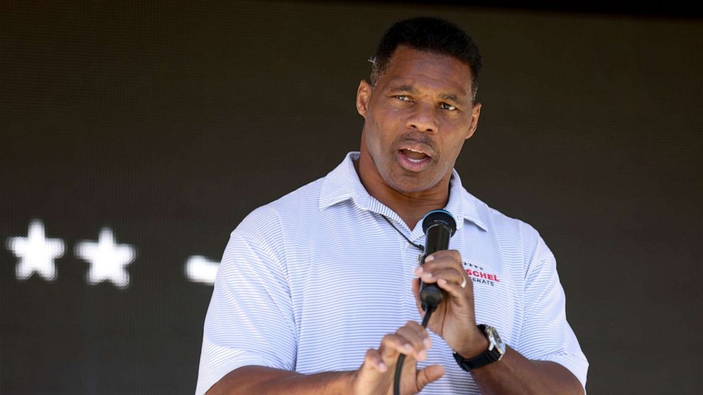 PHOTO: Republican Senate candidate Herschel Walker speaks during a ''Unite Georgia Bus Tour,'' at The Mill on Etowah, on Sept. 27, 2022, in Canton, Ga.
