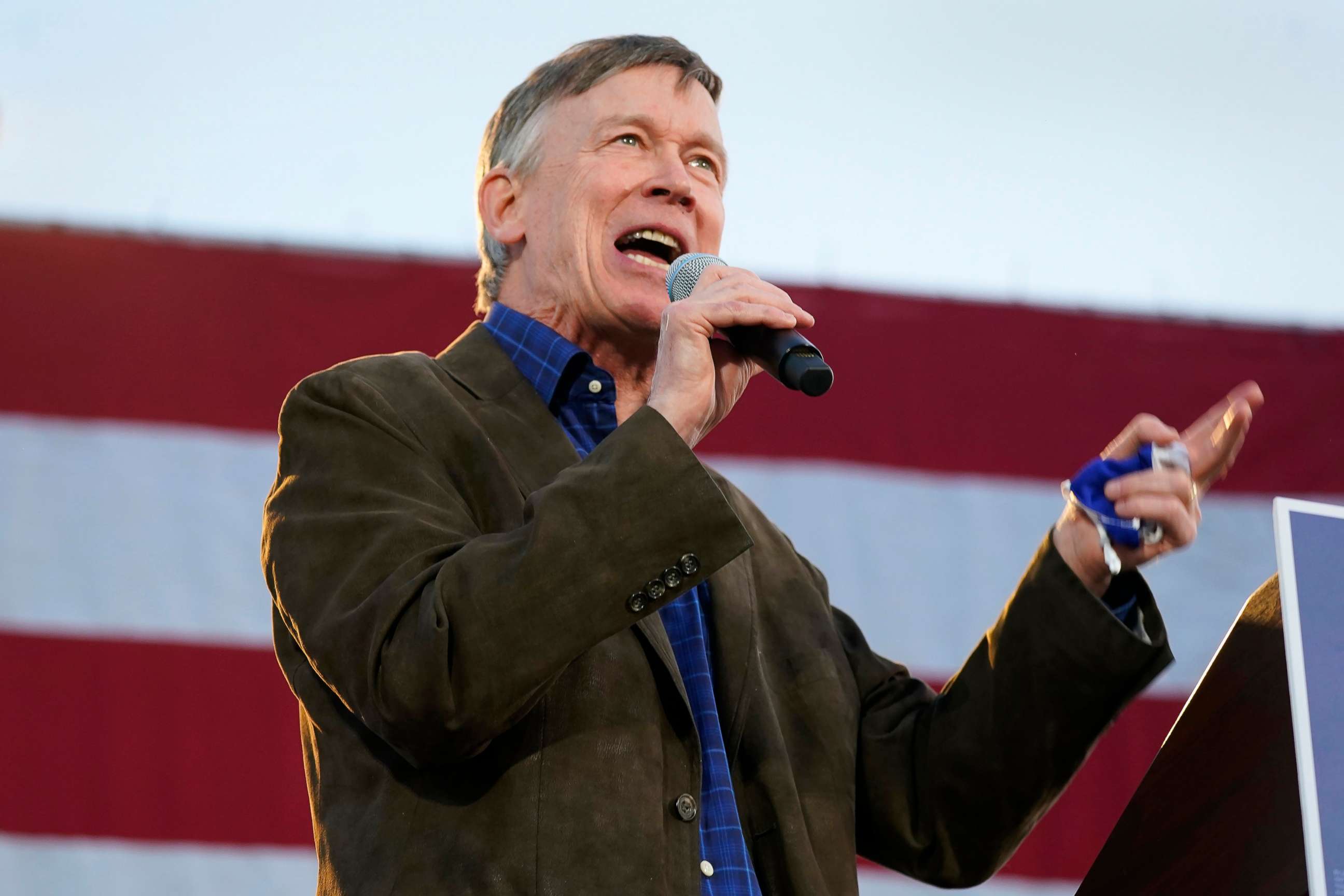 PHOTO: John Hickenlooper, Democratic candidate for the U.S. Senate seat in Colorado, speaks during a car rally in Denver, Oct. 8, 2020.