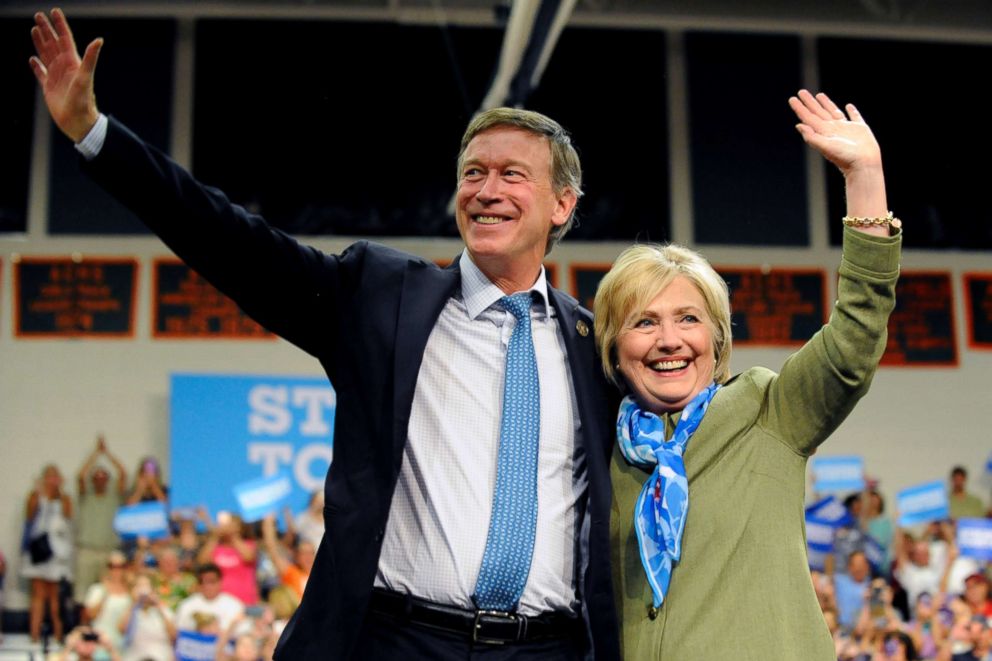 PHOTO: Democratic presidential nominee Hillary Clinton and Colorado Governor John Hickenlooper wave to supporters after her speech at Adams City High School in Commerce City, Colo., Aug. 3, 2016.