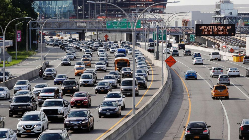 Cars on the Grand Central Parkway pass LaGuardia Airport in New York, Aug. 1, 2018. The Trump administration has proposed rolling back tougher Obama-era gas mileage requirements that are set to take effect after 2020.