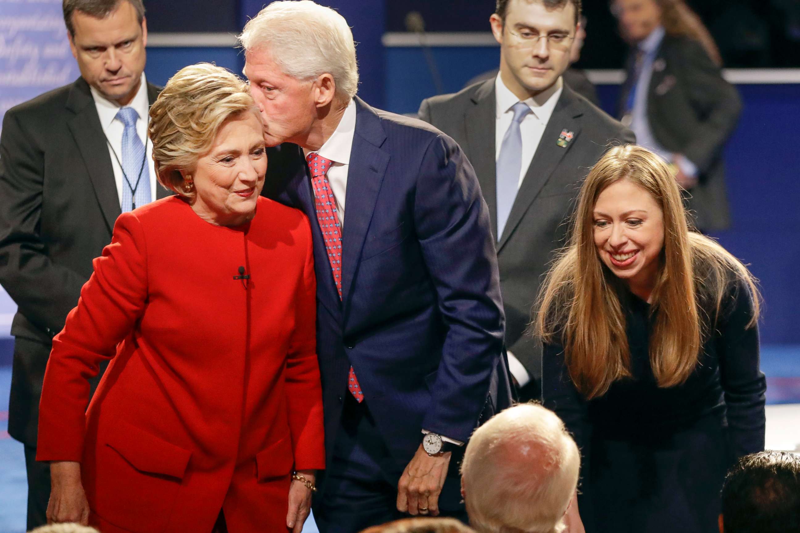 PHOTO: Former President Bill Clinton kisses Democratic presidential nominee Hillary Clinton as she and their daughter Chelsea Clinton greet supports during the presidential debate at Hofstra University in Hempstead, N.Y., Sept. 26, 2016.