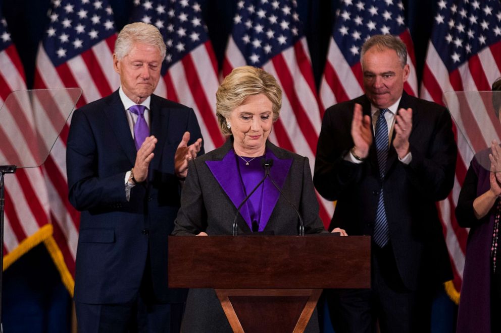 PHOTO: Former Secretary of State Hillary Clinton concedes the presidential election as her husband former President Bill Clinton and her running mate Tim Kaine applaud at the New Yorker Hotel on Nov. 9, 2016, in New York.