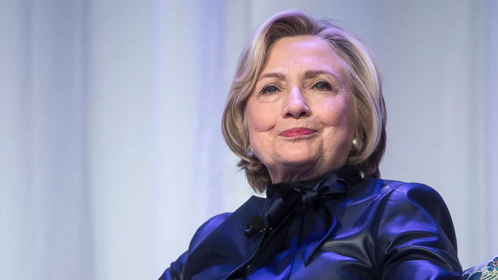 PHOTO: Hillary Clinton sits on stage during a book tour event in Vancouver, British Columbia, Canada.