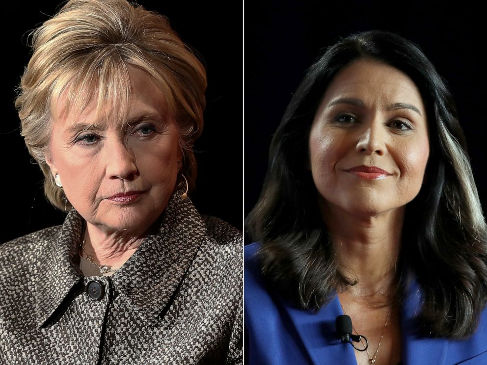 PHOTO: Former United States Secretary of State Hillary Clinton attends an event in New York, April 6, 2017. | Democratic presidential candidate Rep. Tulsi Gabbard attends an event in Cedar Rapids, Iowa, July 17, 2019.