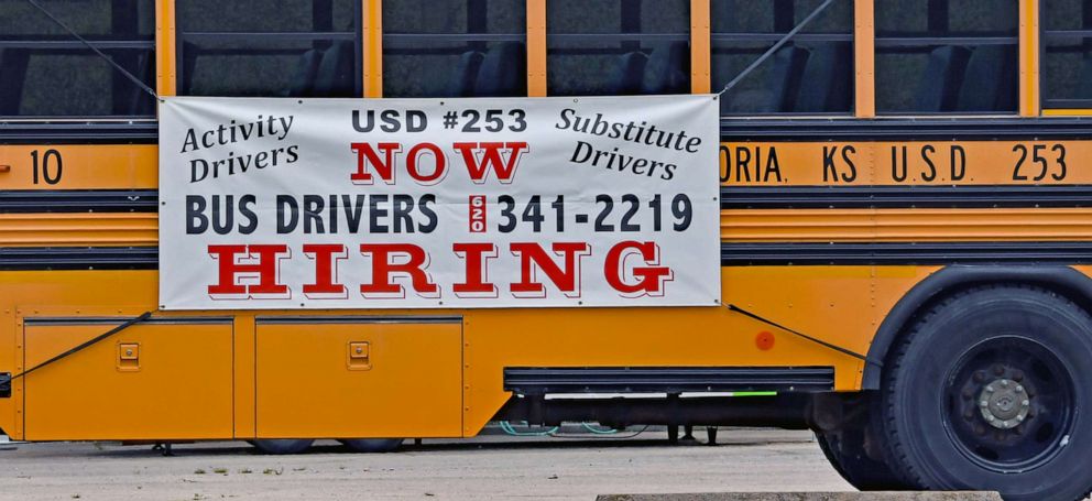 PHOTO: A hiring sign is posted on the side of school bus in Emporia, Kansas, May 5, 2021.