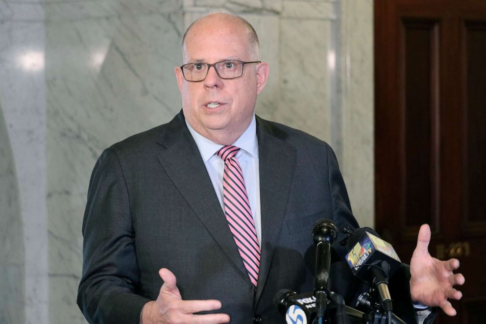 PHOTO: Maryland Gov. Larry Hogan talks to reporters after signing a measure to enact a new congressional map, April, 4, 2022, for the state's eight U.S. House seats.