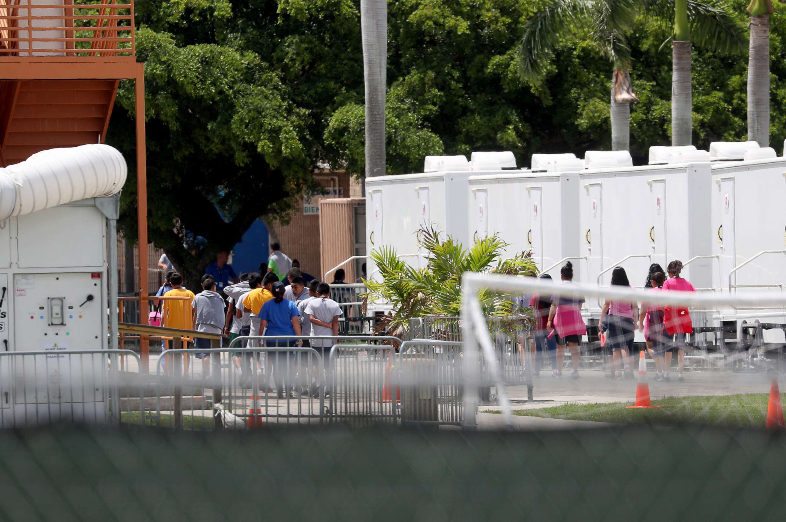 PHOTO: People walk inside the Homestead Temporary Shelter for Unaccompanied Children on June 19, 2018 in Homestead, Fla.