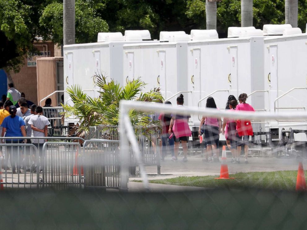 PHOTO: People walk inside the Homestead Temporary Shelter for Unaccompanied Children on June 19, 2018 in Homestead, Fla.
