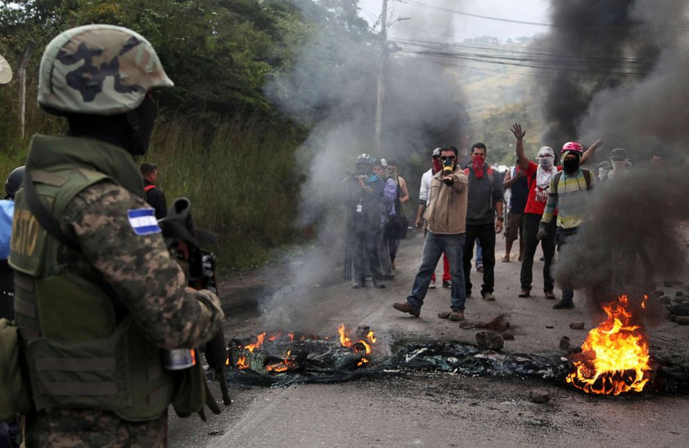 PHOTO: In this Dec. 22, 2017, file photo, locals confront soldiers at a barricade set up by protestors supporting opposition presidential candidate Salvador Nasralla, in the outskirts of Tegucigalpa, Honduras.