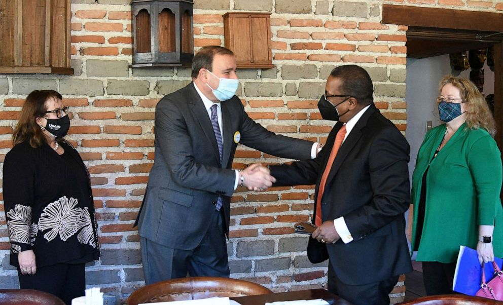 PHOTO: The U.S. Dept. of State Assistant Secretary for Western Hemisphere Affairs Brian A. Nichols (2nd R) shakes hands with the president of the Honduran Council of Private Enterprise (COHEP) Juan Carlos Sikaffy in Tegucigalpa, Honduras, Nov. 22, 2021.