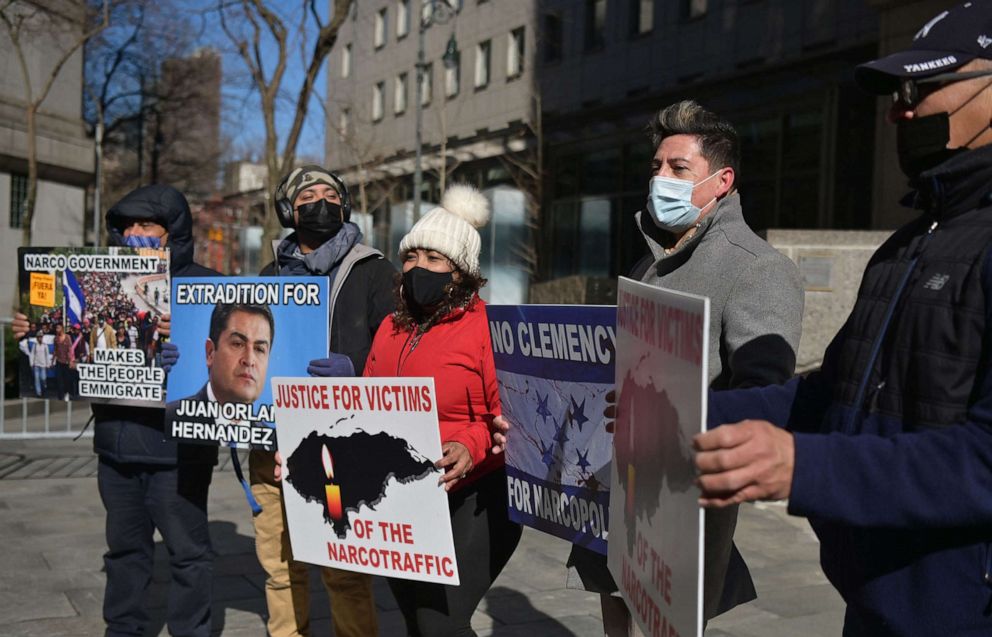 PHOTO: Members of the honduran opposition protest as the trial of Geovanny Fuentes Ramirez, a Honduran accused of drug trafficking and firearms possession takes place at the Manhattan federal court in New York, March 19, 2021.