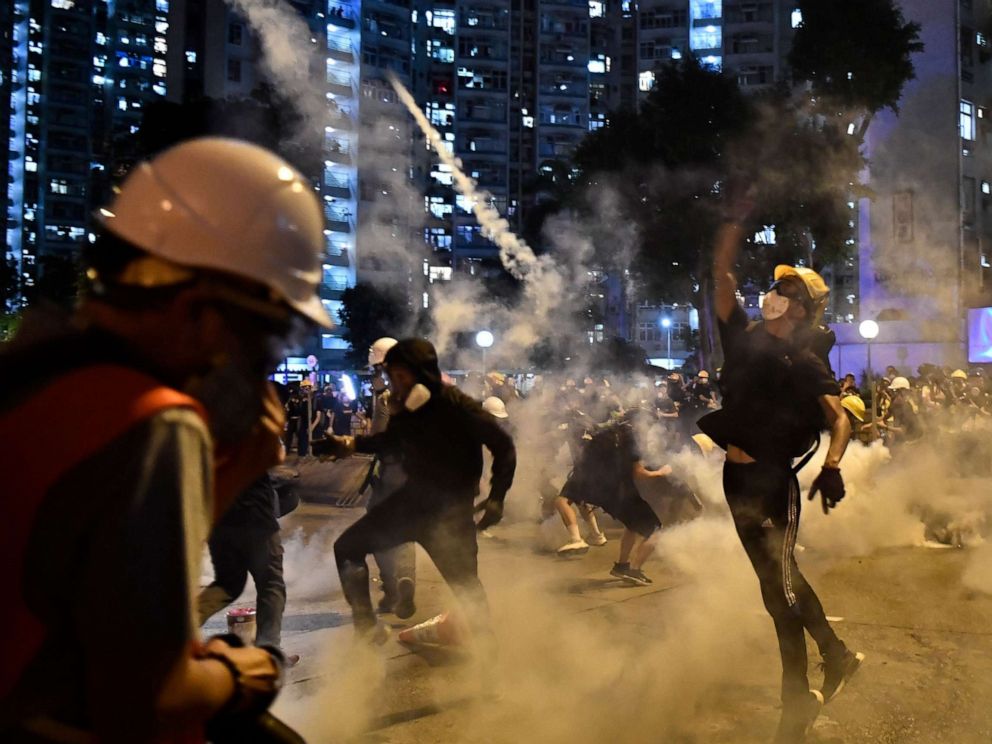 PHOTO: Protesting Throwing back Tear gas Fired by the police in Wong Tai Sin during a general Strike in   on Ogos 5, 2019.