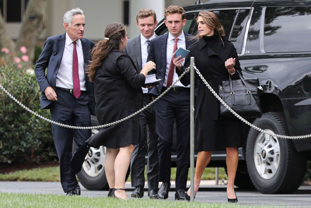 PHOTO: Counselor to the President Hope Hicks and White House coronavirus adviser Dr. Scott Atlas, walk on the South Lawn of the White House before they enter the Presidential motorcade in Washington, Sept. 12, 2020.