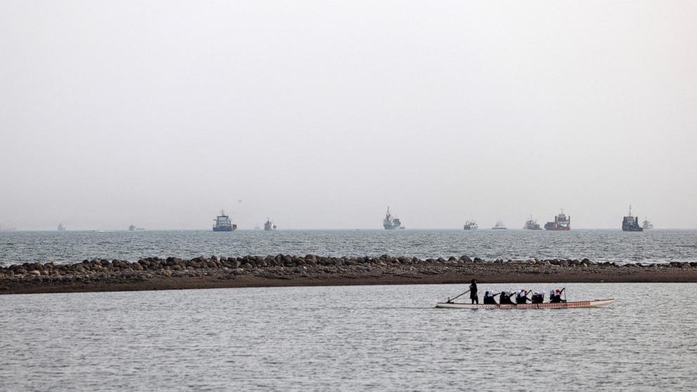 PHOTO: Vessels in the Strait of Hormuz are visible near the beach of Bandar Abbas, Iran, May 22, 2026.