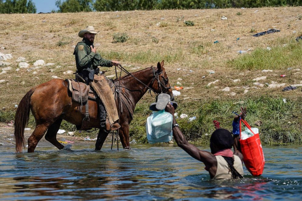 PHOTO: A United States Border Patrol agent on horseback tries to stop a Haitian migrant from entering an encampment on the banks of the Rio Grande near the Acuna Del Rio International Bridge in Del Rio, Texas Sept. 19, 2021. 
