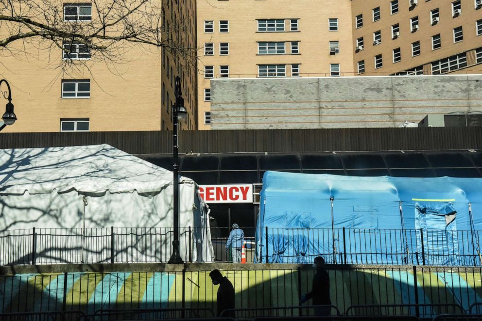 PHOTO: People stand in line to be tested for the coronavirus at Elmhurst Hospital, April 1, 2020, in New York.