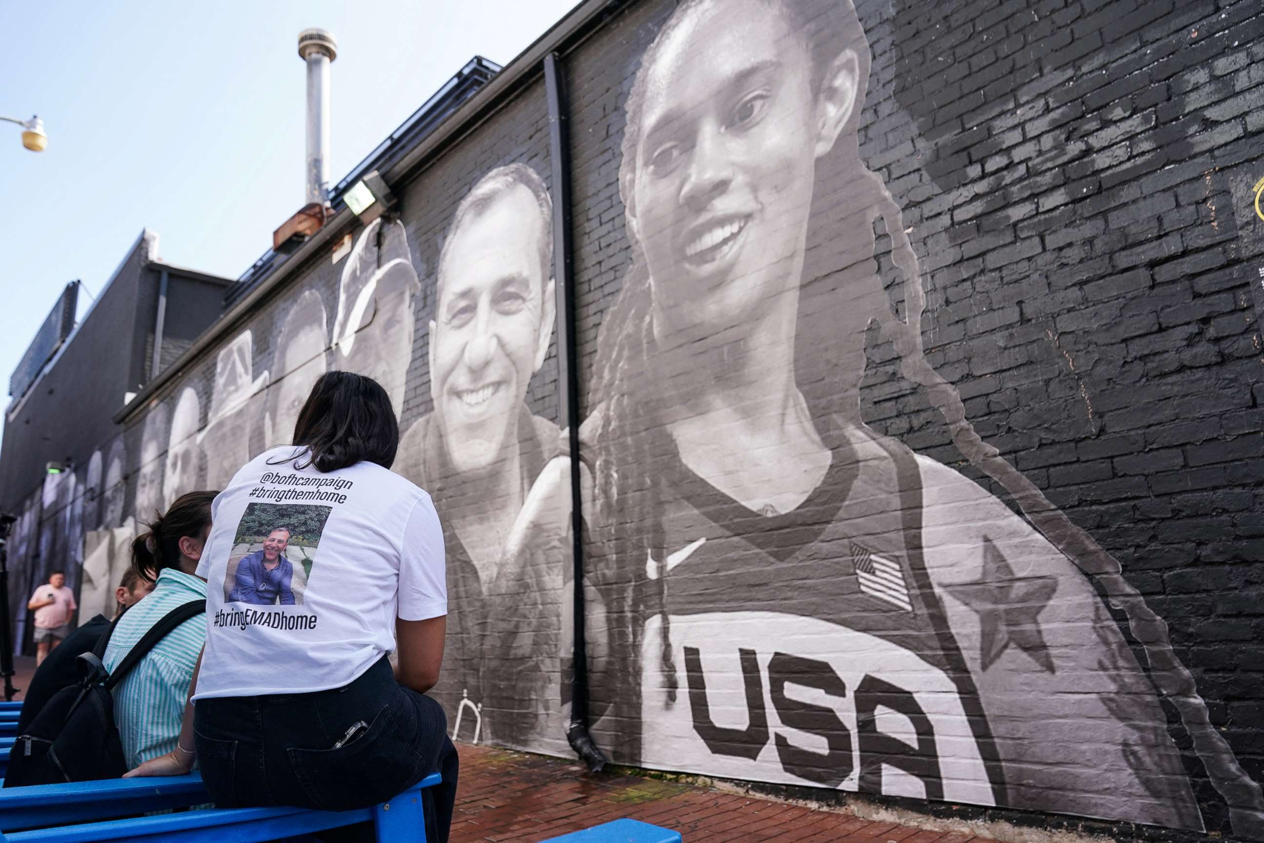 PHOTO: People visit a mural of Brittney Griner and other hostages around the world created by the Bring Our Families Home Campaign, a campaign for Americans wrongfully detained or held hostage abroad, in Washington, D.C., July 20, 2022.