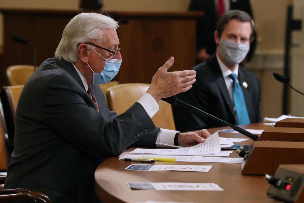 PHOTO: House Majority Leader Steny Hoyer (D-MD) (L) and Rep. Rodney Davis (R-IL) wear face masks while testifying to the House Rules Committee about the proposal to authorize remote voting by proxy in the House of Representatives.