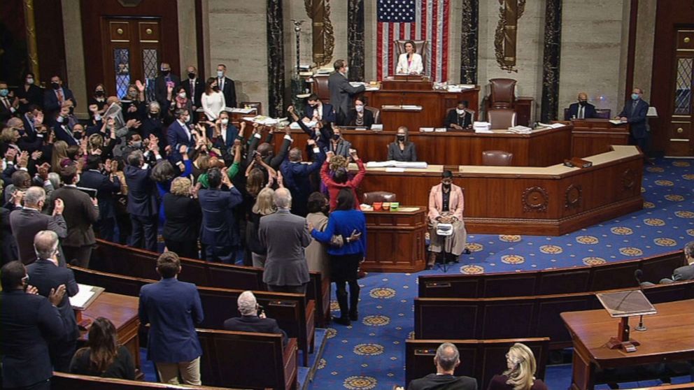 PHOTO: Democrats cheer after passing the "Build Back Better Act" 220-213 on the House Floor, Nov. 19, 2021, at the Capitol in Washington, D.C.