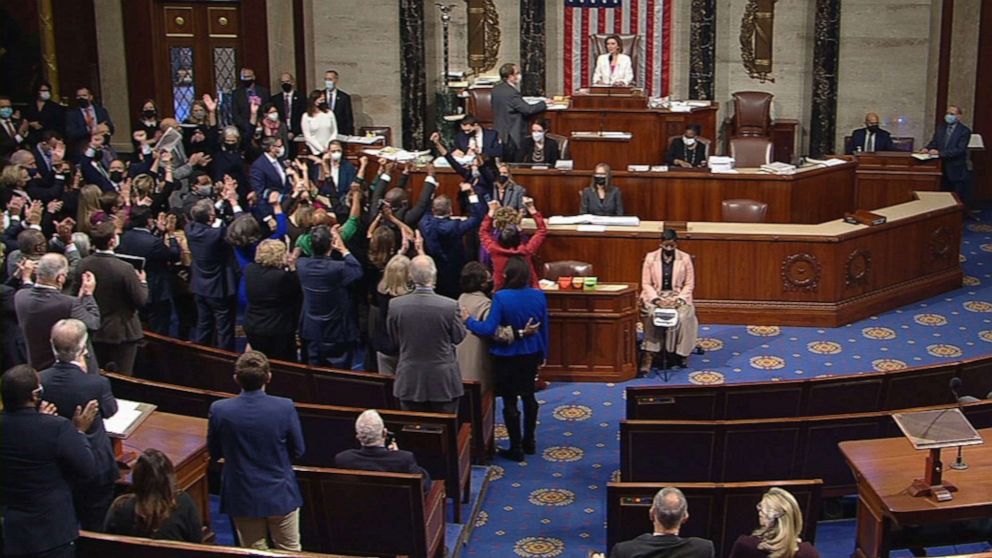 PHOTO: Democrats cheer after passing the "Build Back Better Act" 220-213 on the House Floor, Nov. 19, 2021, at the Capitol in Washington, D.C.
