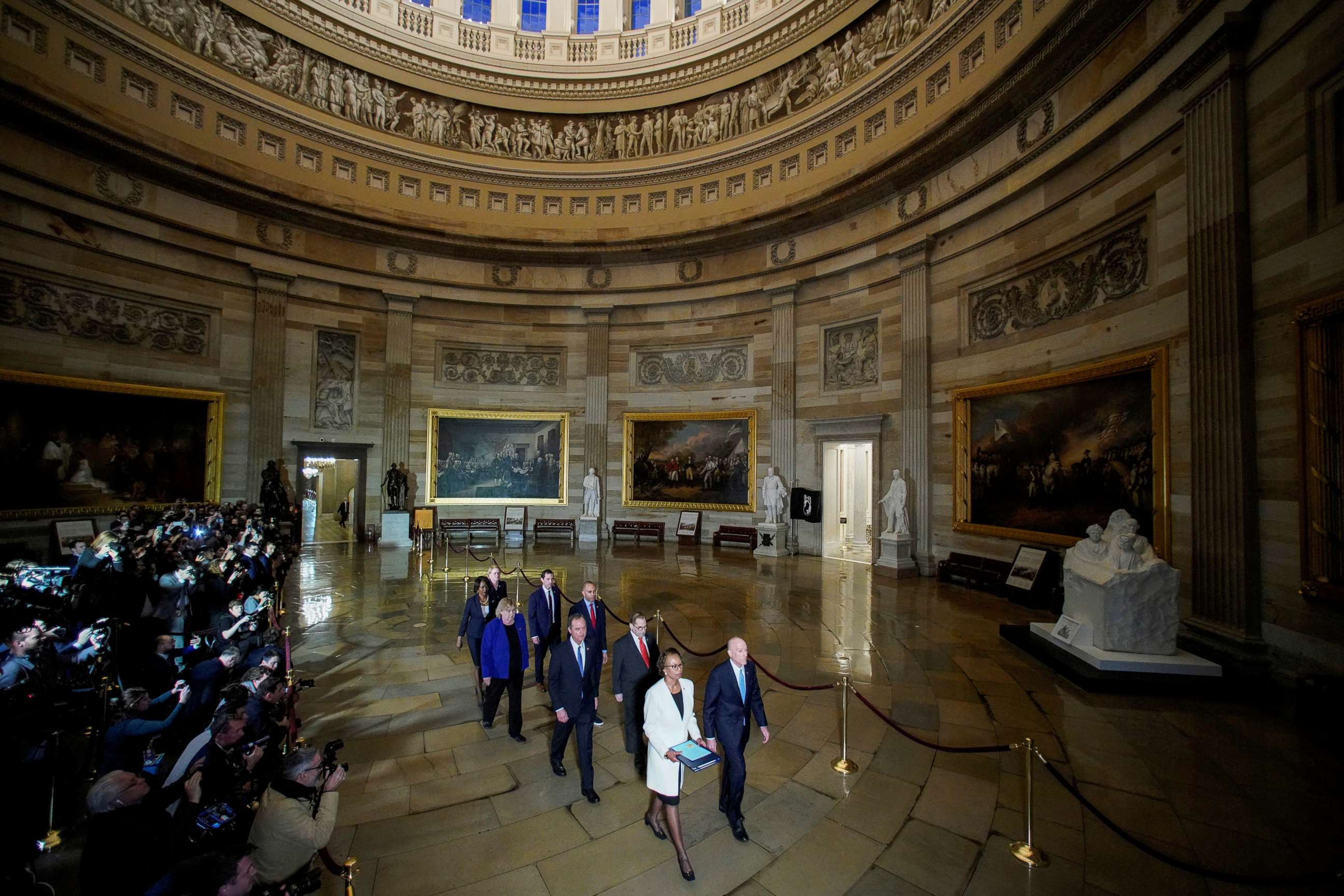 PHOTO: House Sergeant at Arms Paul Irving and House Clerk Cheryl Johnson carry two articles of impeachment against President Trump during a procession with the seven House impeachment managers in Washington, Jan. 15, 2020.