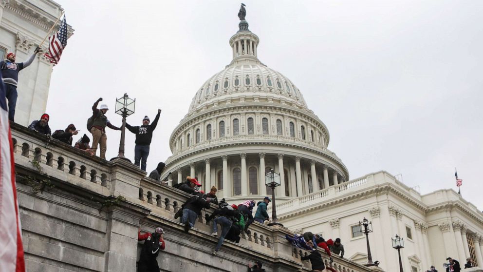 PHOTO: Supporters of President Donald Trump climb on walls at the U.S. Capitol during a protest against the certification of the 2020 U.S. presidential election results by Congress, in Washington, Jan. 6, 2021.