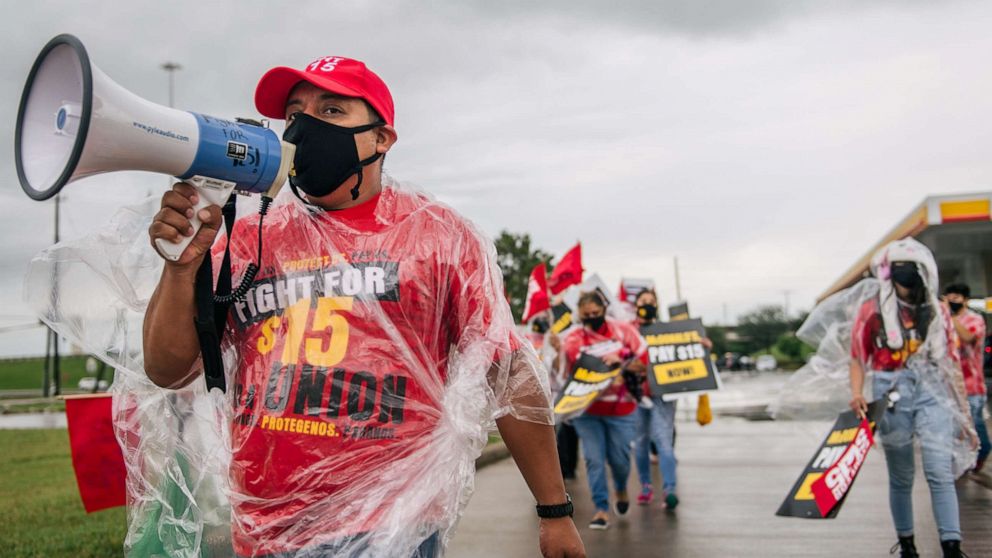 PHOTO: Armando Tax, an organizer for Fight For $15, chants during a rally on May 19, 2021 in Houston.