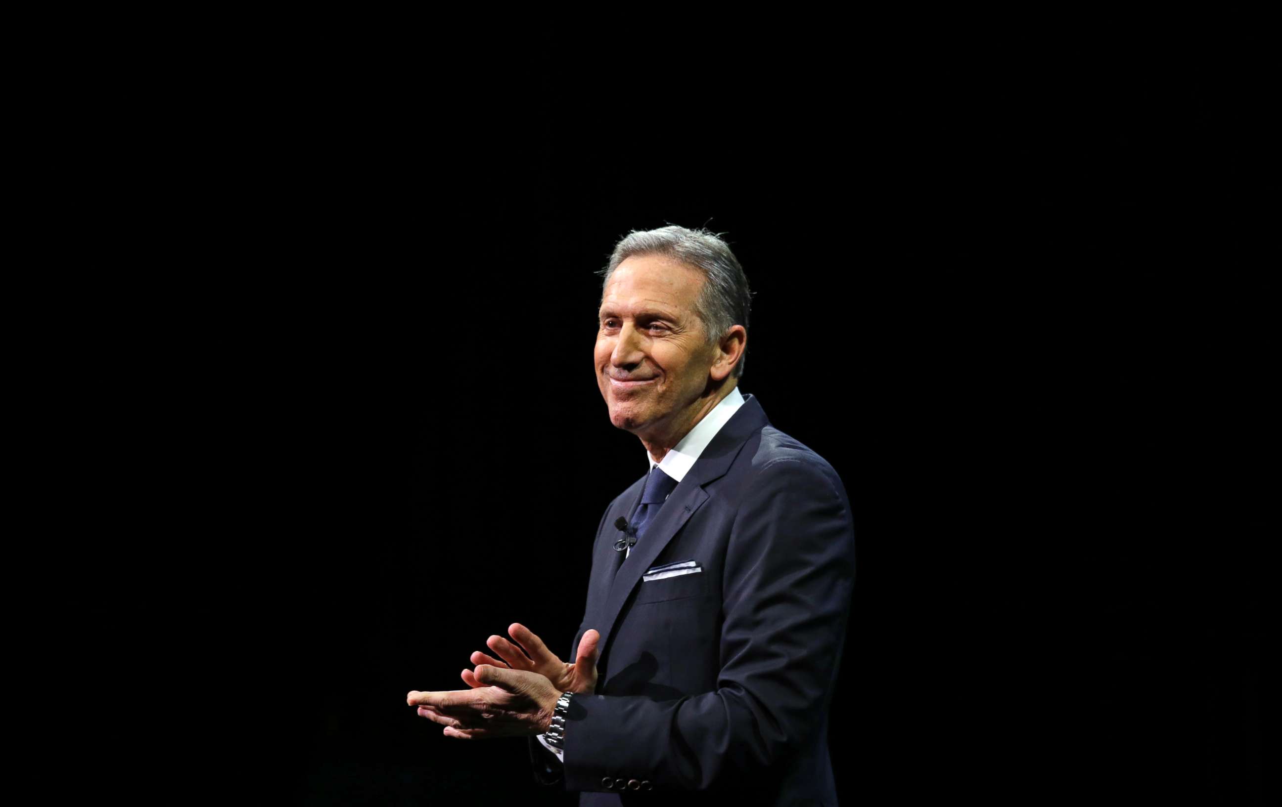 PHOTO: Then-Starbucks CEO Howard Schultz pauses as he speaks to applaud employees at the Starbucks annual shareholders meeting, March 22, 2017, in Seattle.