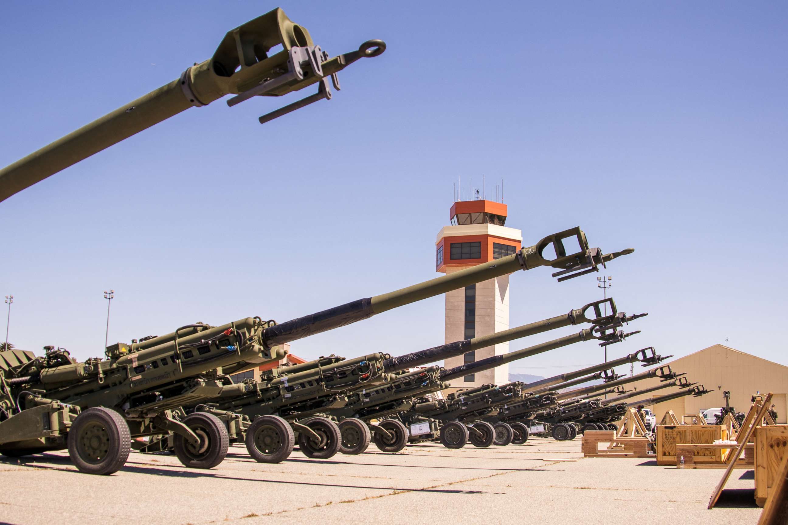PHOTO: U.S. Marine Corps M777 towed 155 mm howitzers are staged on the flight line prior to being loaded onto a U.S. Air Force C-17 Globemaster III aircraft bound for Europe for delivery to Ukrainian forces, at March Air Reserve Base, April 22, 2022.
